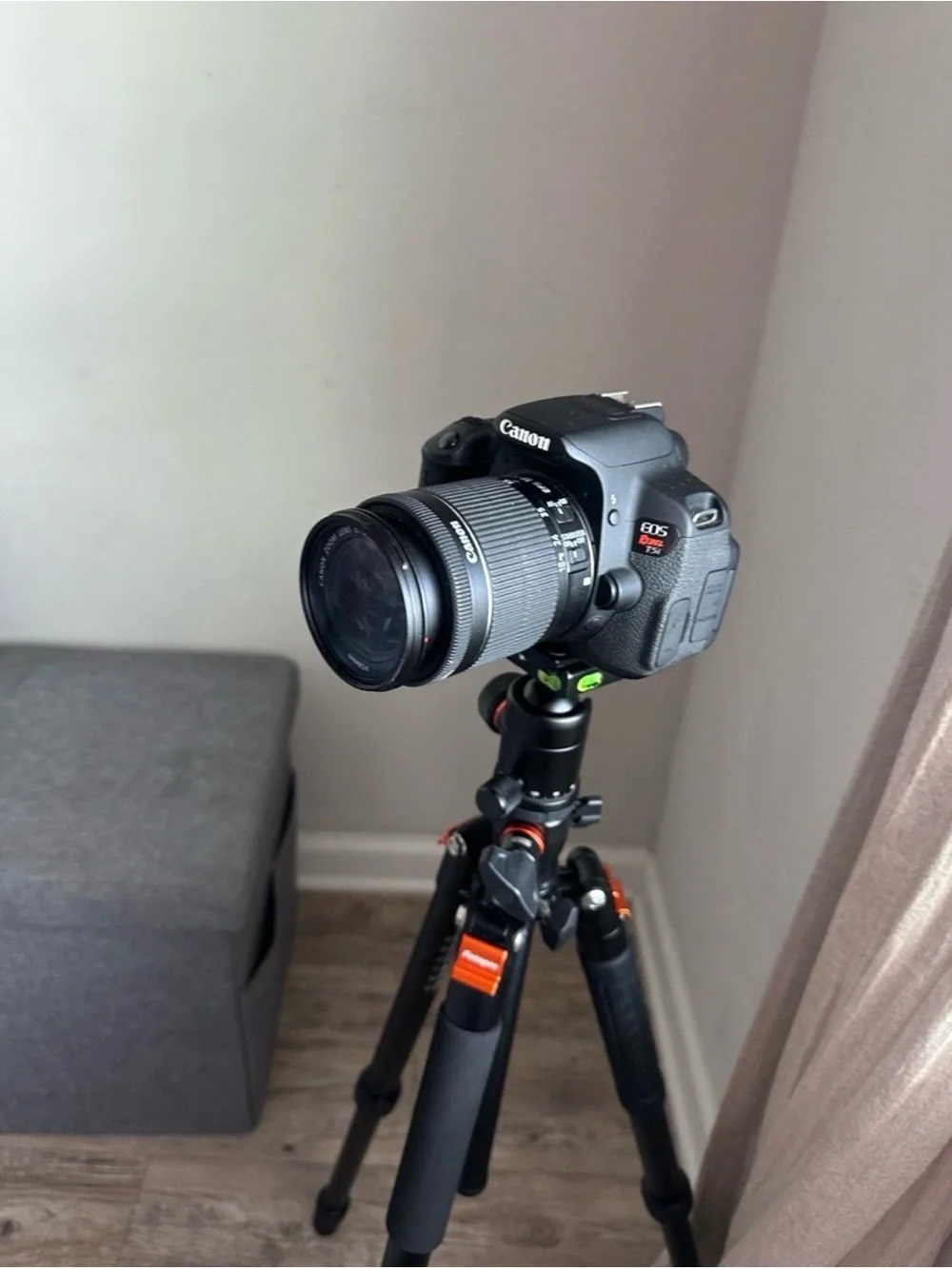 Canon Black DSLR Camera with Rotating LCD and Black Tripod